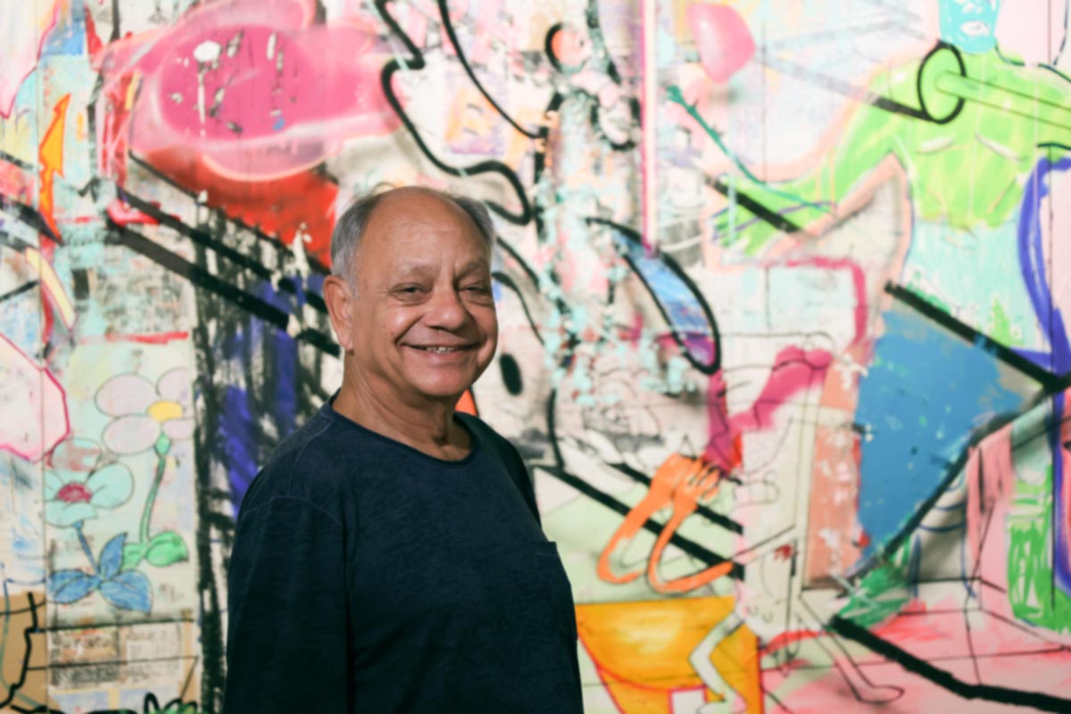 Cheech Marin in front of Cande Aguilar work