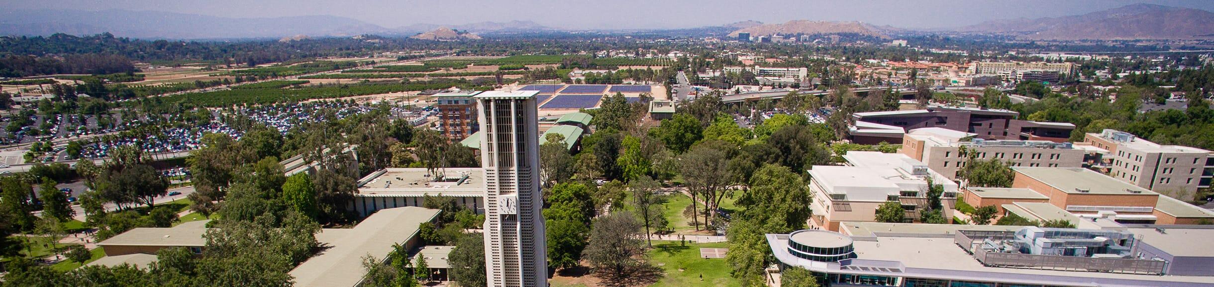 Aerial view of UC Riverside campus with bell tower in front view